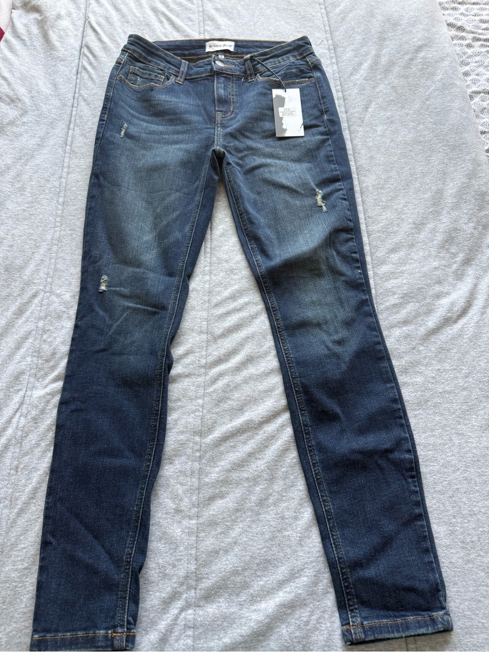 Women’s Skinny Dark Wash Stretch Jeans with Light Distressing